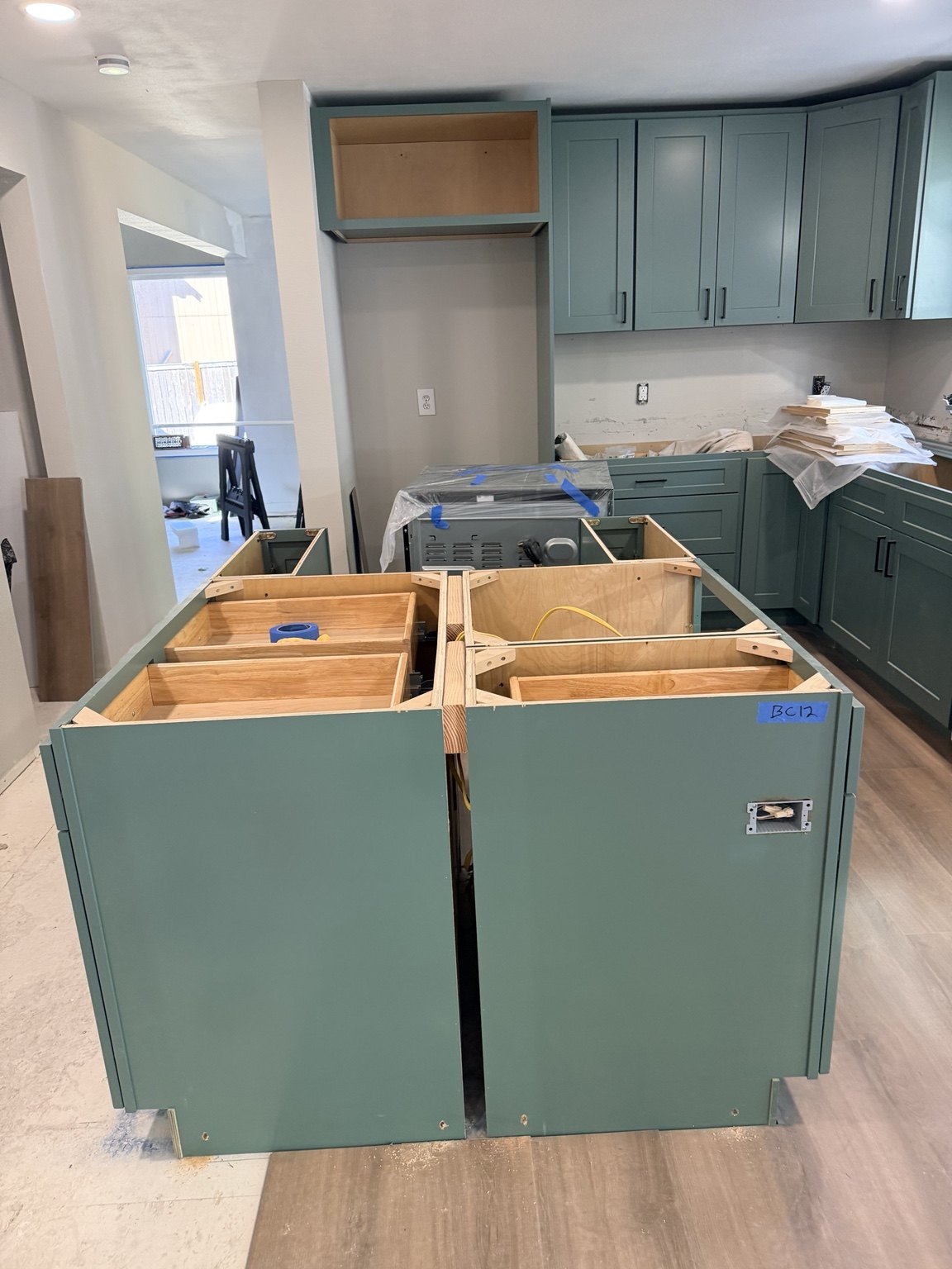 Custom green kitchen cabinets